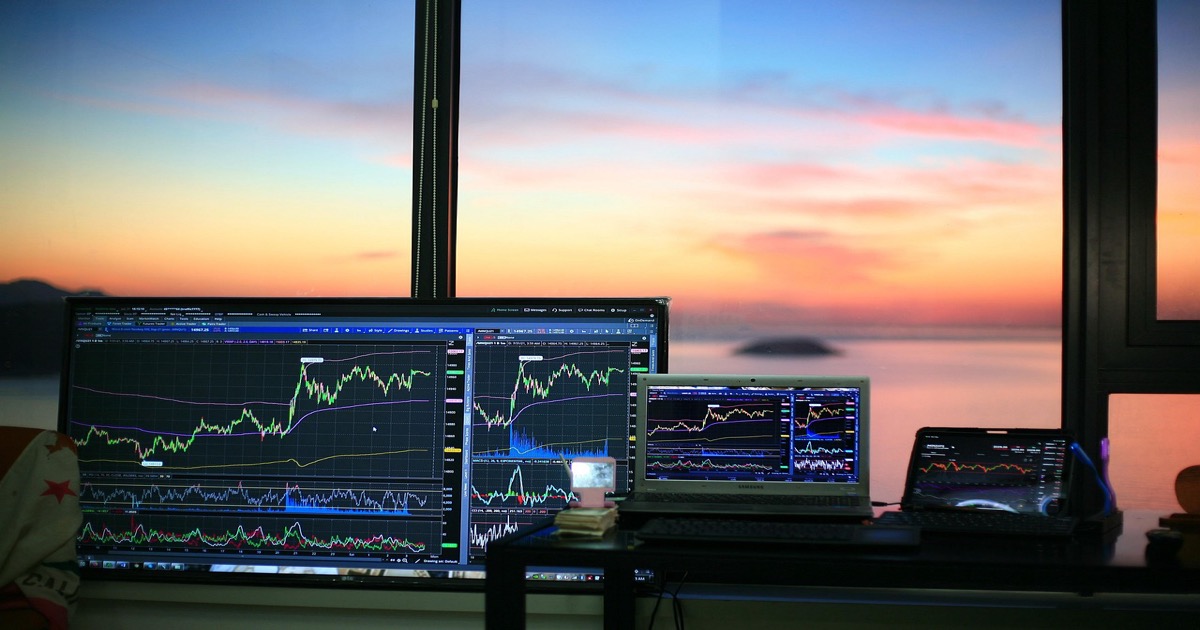 Stock trading screens showing market data and price charts