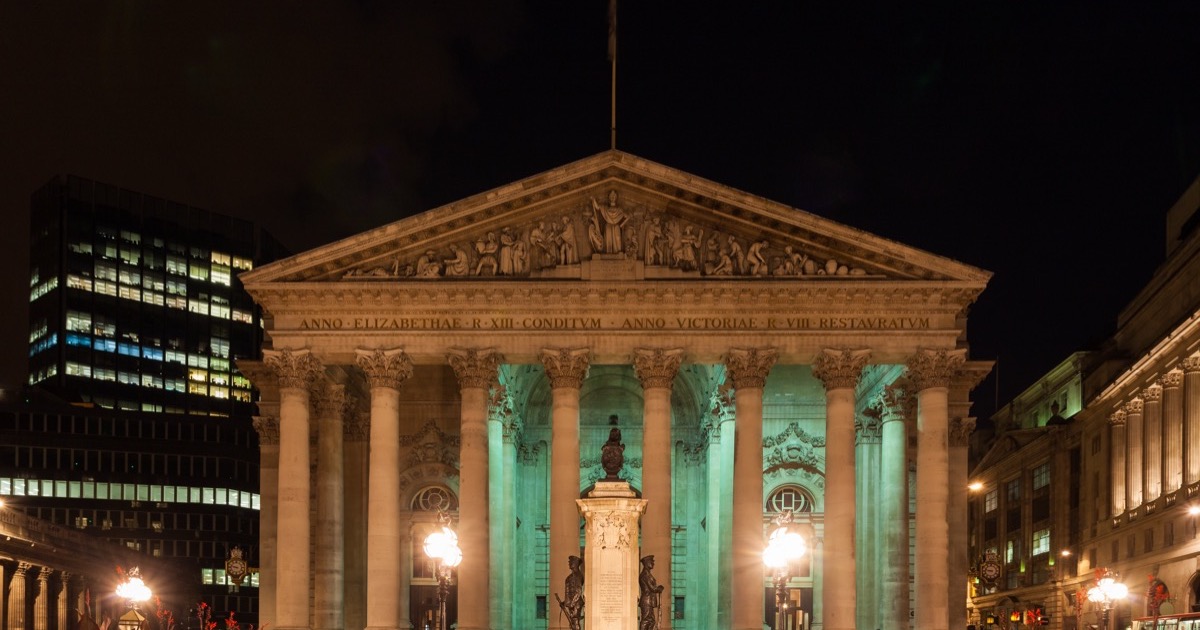 The Royal Exchange in the City of London financial district lit up at night, as Wall Street closed out the first half of 2026 on June 30.