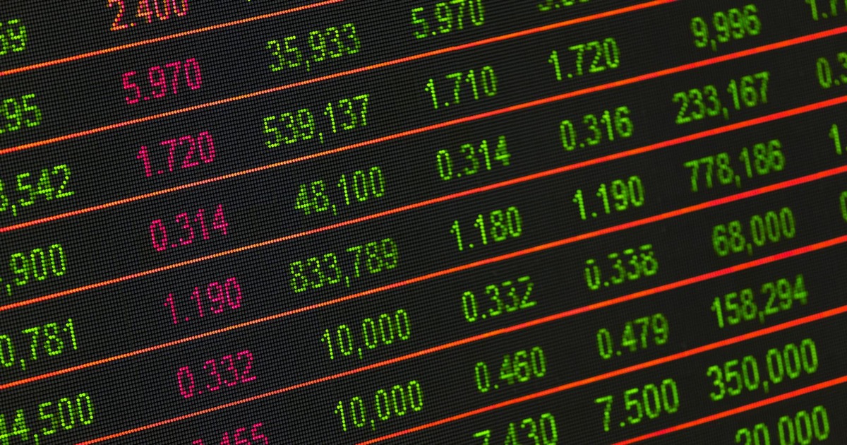 Stock exchange display board showing financial market data and trading indices