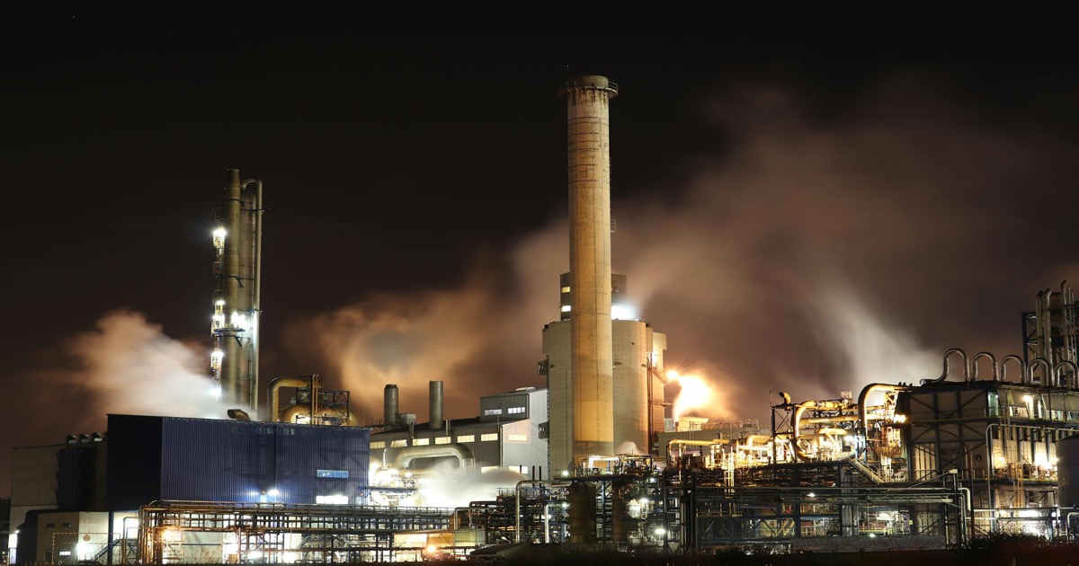 Industrial oil refinery illuminated at night &mdash; end-of-day market wrap March 26, 2026