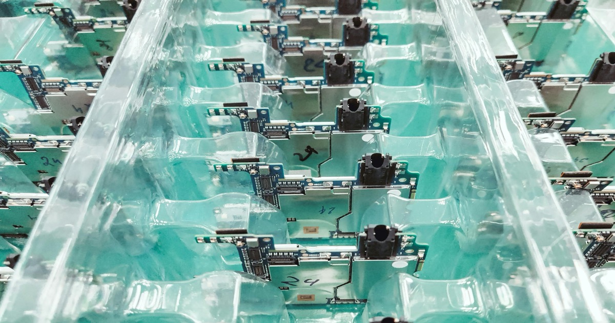 Electronic circuit boards move through a production line, symbolizing the AI chip rally that led the May 26 market close.