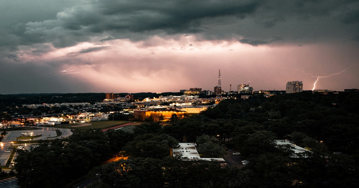 Dark storm clouds gathering over a city skyline symbolizing market reversal before Good Friday &mdash; morning update April 2, 2026