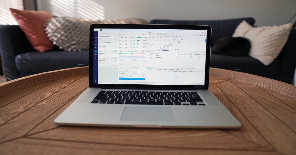 Stock trading screens displaying financial charts and market data on a Tuesday morning