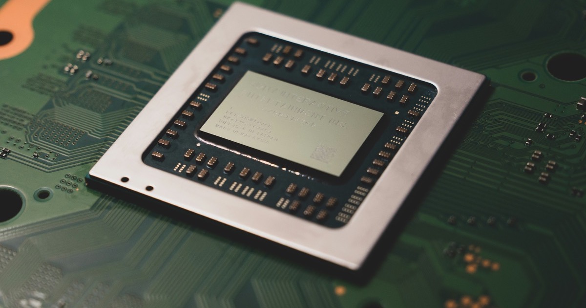 A close-up computer processor on a circuit board, representing the AI chip rally on August 13, 2026.
