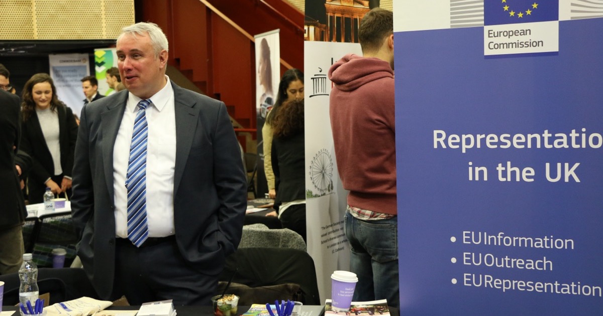 Job seekers and recruiters at a career fair, on the morning of August 7, 2026.