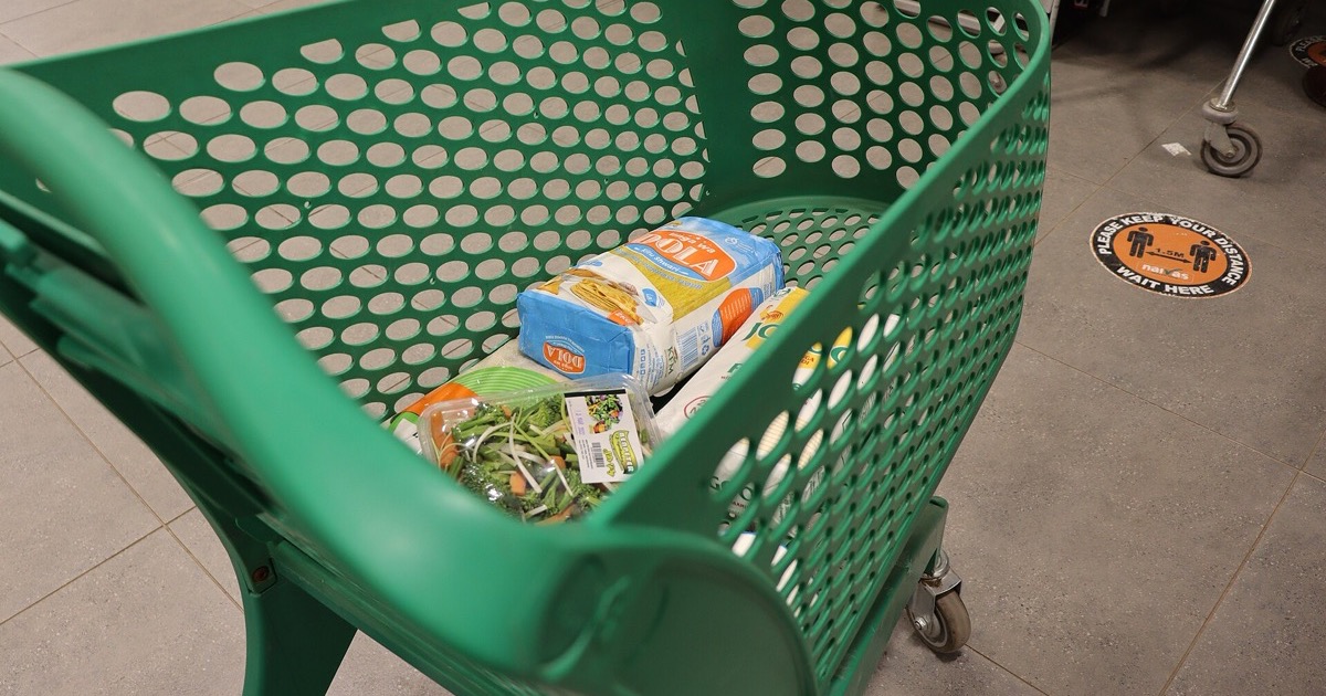 A shopping cart in a supermarket aisle, on the morning of July 14, 2026.