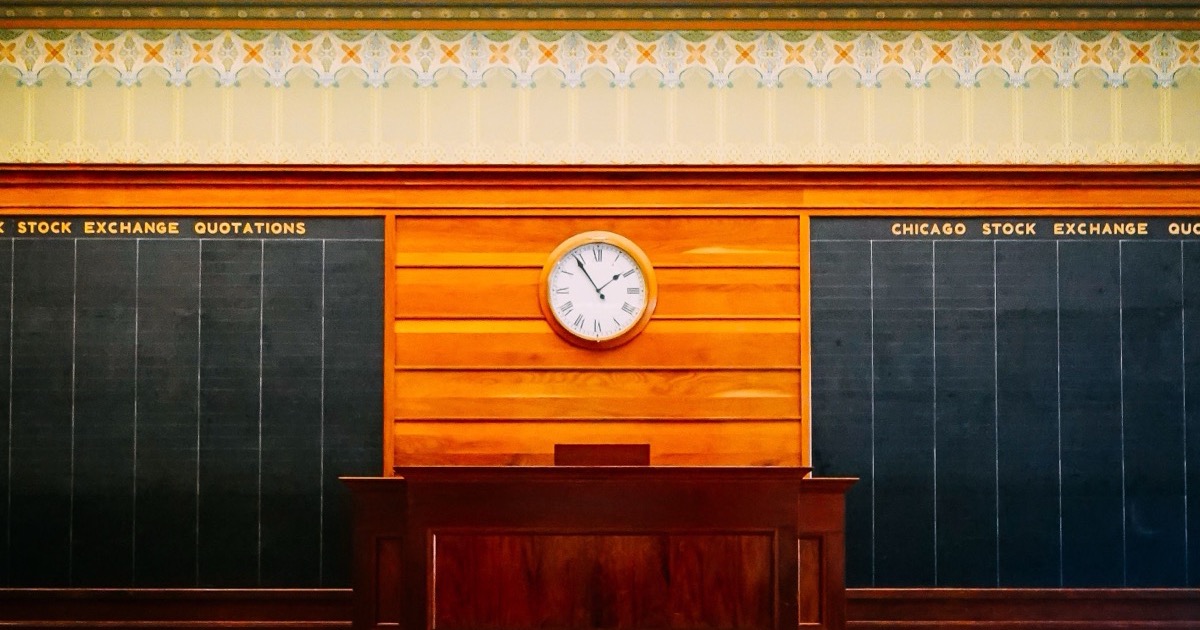 Elegant Chicago Stock Exchange Trading Room interior with a vintage clock, matching the Juneteenth holiday-market setup for June 19, 2026.