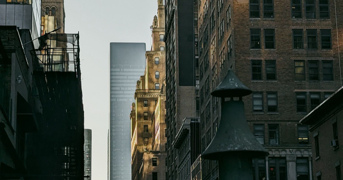 A quiet financial district street at dawn, symbolizing the June 9, 2026 morning market update as futures rise, oil falls and traders prepare for CPI.