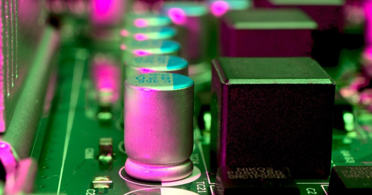Close-up of an AI accelerator motherboard glowing pink &mdash; AMD blowout and AI rally May 6, 2026
