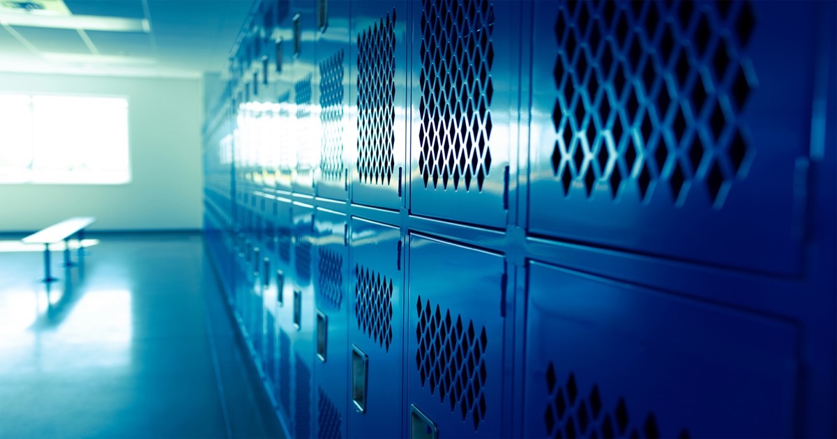 Server room with rows of blue-lit data center cabinets representing the AI infrastructure driving software stock momentum