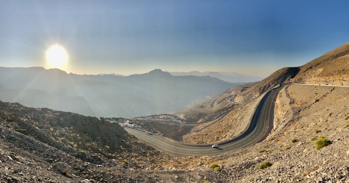Sunrise over a winding mountain road, symbolizing the trading week ahead of August 3, 2026.