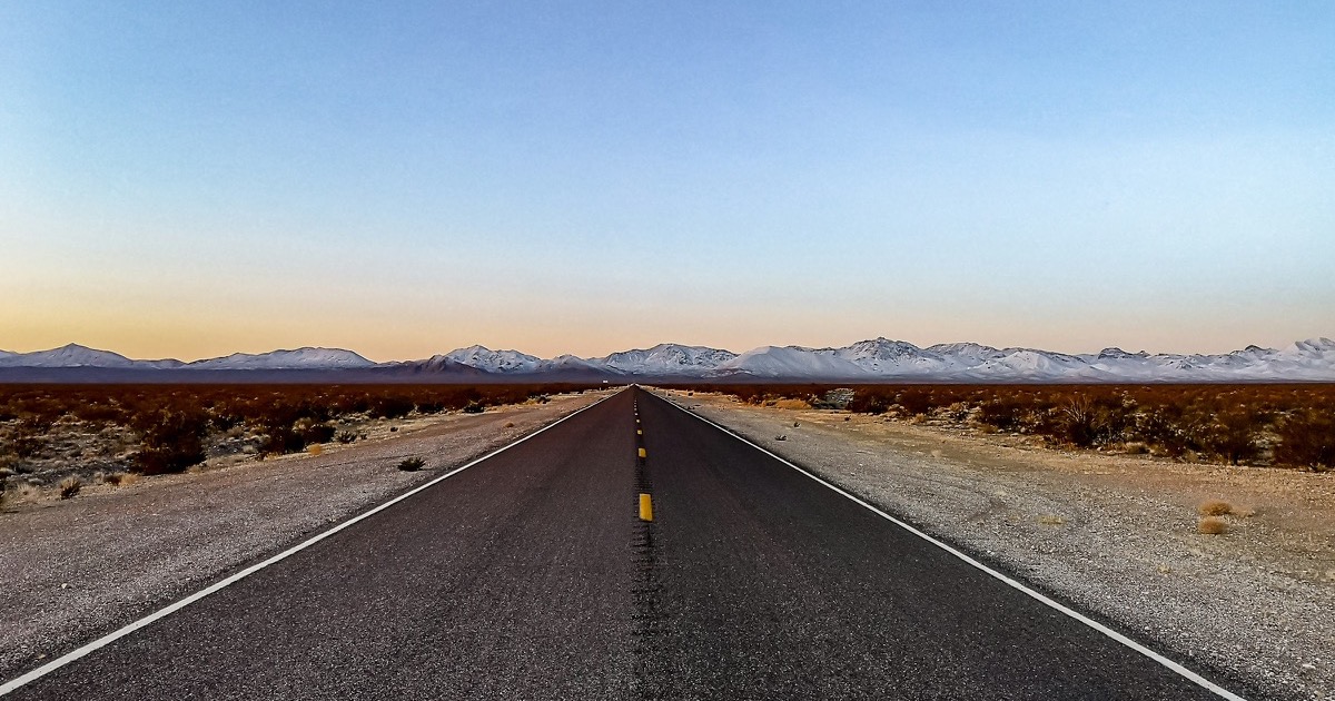 An empty desert road points toward the week's inflation and policy decision